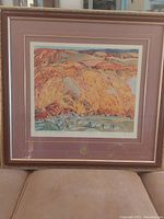 Full view of framed A J Casson limited edition print showing the landscape scene with autumn colors, village, and wide matting with gold medallion