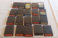 Photo showing 20 Intellivision video game cartridges with visible labels and titles.