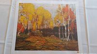 Full view of one print showing fall forest scene with colorful autumn leaves and textured brushstrokes.