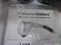 Photo of Homedics Therapist Select hand massager manual showing the device and branding.