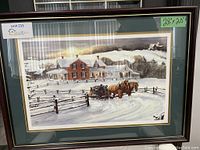 Full view of the framed print showing the winter homestead scene with a horse wagon and wooden fence in foreground, with a green mat and glass frame.
