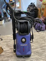 Front view of Simoniz power washer showing hose reel and spray gun attached
