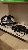 Photo of Mastercraft 7.25 inch circular saw and Black & Decker jigsaw on a shelf