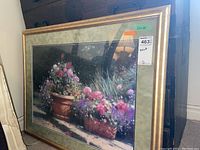 Full view of the framed floral print depicting vibrant flowers in pots, showing condition and dimensions.