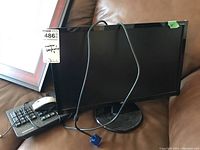 Acer 20 inch monitor with VGA cable attached, viewed at front and slightly angled showing the entire screen and base stand.