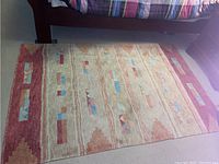 Full top view of the rectangular Tibetan Art rug showing pattern and colors.