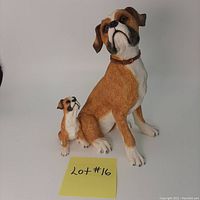 Front view of the Boxer adult dog and puppy resin figurine showing detailed hand painting and coloring.