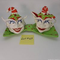 Front view of ceramic Christmas elf cream and sugar set on matching tray showing detailed faces and hats