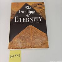 Front cover of 'The Dwellings of Eternity' coffee table book showing a pyramid.