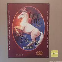 Metal promotional beer sign for Royal City Lager and Cream Ale by F & M Brewery. Features a crowned white horse rearing inside an oval, surrounded by text and branding on a red background.