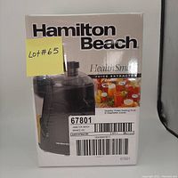 Front box view showing Hamilton Beach branding, model number 67801, image of the juice extractor, and lot number sticker.