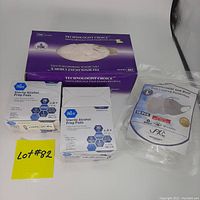 Photo shows box of 100 Technologist Choice vinyl examination gloves size SMALL, three boxes of Med Pride sterile alcohol prep pads, and a resealable bag containing 6 Reference Labs size LARGE masks.