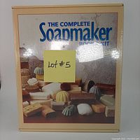 Front cover of The Complete Soapmaker Book & Kit showing assorted soap bars and molds, new sealed box.