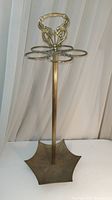 Full view of brass umbrella holder stand showing overall shape and design