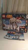 Front view of the LEGO Star Wars 75054 box with AT-AT Walker model image and instruction booklet 1 placed in front.