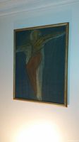 Framed abstract figure painting on canvas hung on wall, showing full artwork and frame.