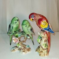 Front view of both porcelain bird figurines against white backdrop