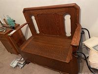 Wooden storage bench shown from front, with arm rests and detailed wood grain visible