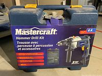 Front view of the Mastercraft hammer drill kit carrying case with branding and product image.