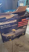 Damaged packaging box displaying brand Mastercraft, model details, and water damaged condition of packaging