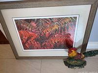 Print and rooster statuette overview