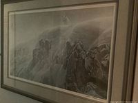 Full frontal view of framed grayscale print showing wolf on snowy cliff