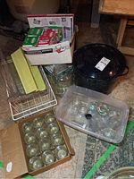 Overview of lot showing enamel pot with lid, boxes of jars, metal racks, and lid boxes