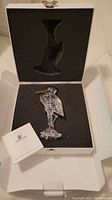 Swarovski crystal heron figurine in foam-lined presentation box with certificate card