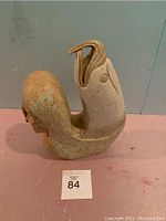 Front view of sculpture showing curved loop and overall form