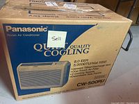 Box showing brand Panasonic and model CW-500RU of room air conditioner