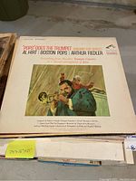Front cover of 'Pops Goes The Trumpet' album showing Al Hirt with trumpet and Boston Pops conducted by Arthur Fiedler.