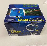 Box of Welltson Portable Laser Party Lighting showing product image and brand.