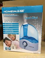 Box front showing Home Image humidifier with model number HI-HYB12BLU, 4.5L capacity, and listed features such as quiet operation, auto shut off, adjustable mist volume, night light, and 360 degree adjustable mist outlet.