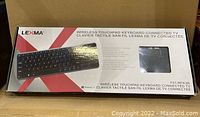 Front view of the Lexma keyboard box showing product image and model information.