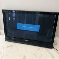 Panasonic 42-inch plasma TV powered on, showing channel not available message on screen.