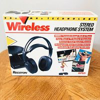 Box for the Recoton Wireless Stereo Headphone System showing product name, features, and image of headphones with charging base.