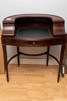 Full front view of the Bombay Queen Anne style desk showing overall condition and design.