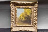 Full view of the small square oil painting in ornate gilded gold frame