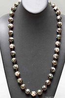Front view of full 26 inch cloisonné enamel beaded necklace on black bust display.