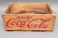 Front view of wooden Coca-Cola crate showing 'Drink Coca-Cola' in large red script lettering.