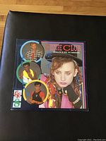 Front cover of 'Colour By Numbers' LP showing band member portraits and album title.