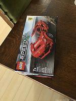 Front angled view of the unopened LEGO Speed Champions Ferrari F8 Tributo box showing the car and product details.