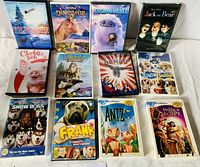 Photo showing all 12 DVDs arranged in a grid on a white surface with titles clearly visible.