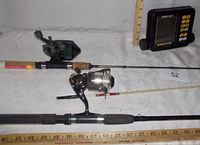 Photo showing two fishing rods with reels, one spincast and one spinning rod, and an Eagle fish finder device with partial missing parts.