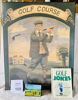 Vintage golfer artwork with golf scope box and golf jokes book in front.