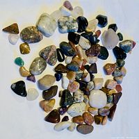 Top view of mixed tumbled polished gemstones