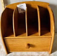 Solid pine desk folder shelf showing front with 4 letter slots and small drawer.