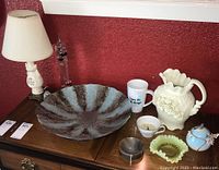 Full view of all items in the lot including lamp, Galileo thermometer, decorative bowl, pitcher, mug, and smaller glass items