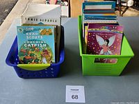 Two plastic baskets holding beginning chapter books for younger readers, arranged upright with covers visible to some extent.