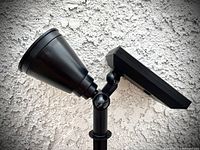 Single InnoGear solar spotlight showing the spotlight head and attached solar panel with adjustable joints.